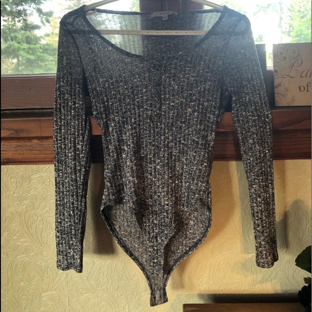 A grey light knit scoop body suit